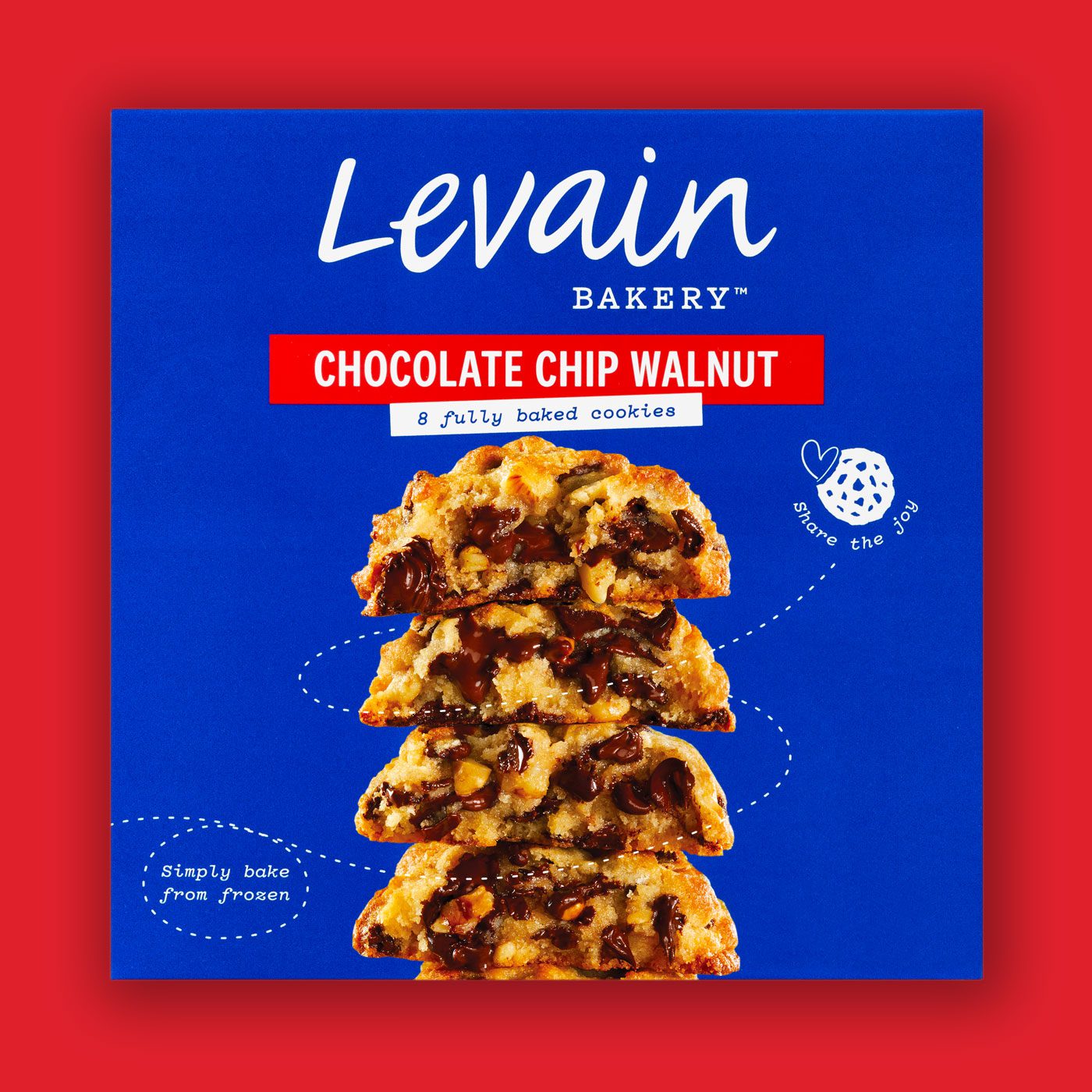 Front face of Levain Bakery Chocolate Chip Walnut Frozen Cookies retail packaging box. The iconic, Levain rich blue box features the Levain typographic logo, red flavor band, "8 fully baked cookies" descriptor, a photographic image of a melty open cookie stack, and their signature cookie heart icon with "share the joy".