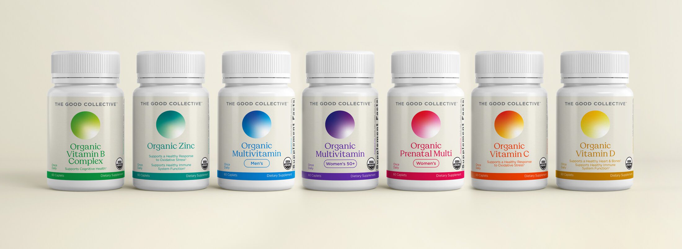 Seven bottles of INFRA's The Good Collective vitamins and supplement bottles lined up in a straight line against a neutral cream background.